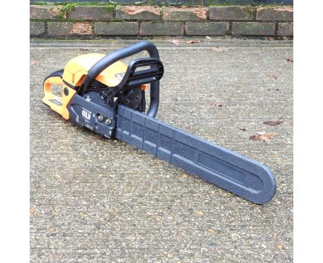 An orange petrol chainsaw