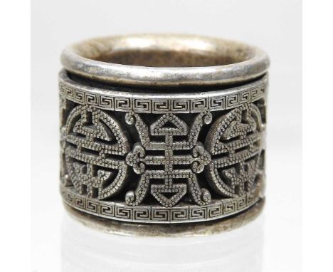 A Chinese white metal archer's ring, of pierced circular shape, 30mm diameter