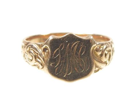 A 9 carat gold signet ring, the central shield engraved with initials, flanked by scrolled shoulders, 3.3g, size N