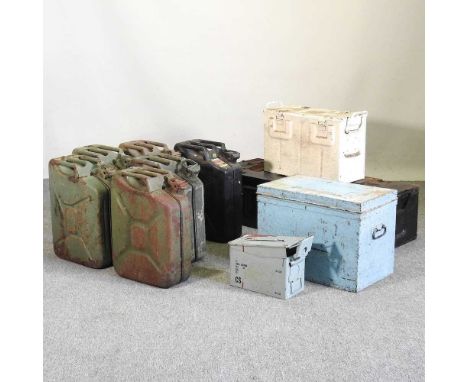 A collection of metal jerry cans, together with various ammunition boxes