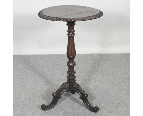 A Victorian carved oak wine table, on a tripod base46w x 75h cm