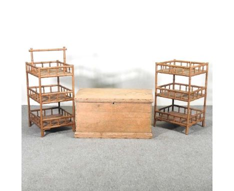 An antique pine trunk, with a hinged lid, together with two bamboo stands (3)79w x 44d x 42h cm