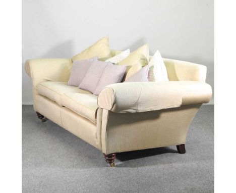 A modern cream upholstered Duresta sofa, on turned legs, with loose cushions237w x 101d x 83h cm