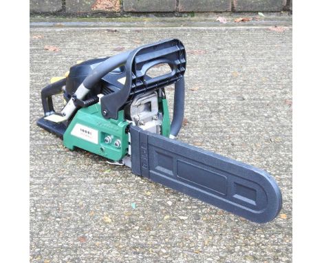 A green petrol chainsaw