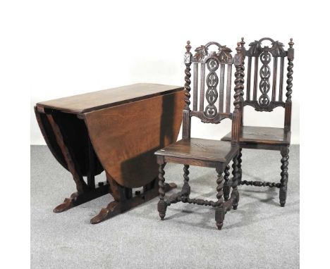 An early 20th century oak drop leaf dining table, attributed to Arthur Romney Green, 1872-1945, together with a pair of early