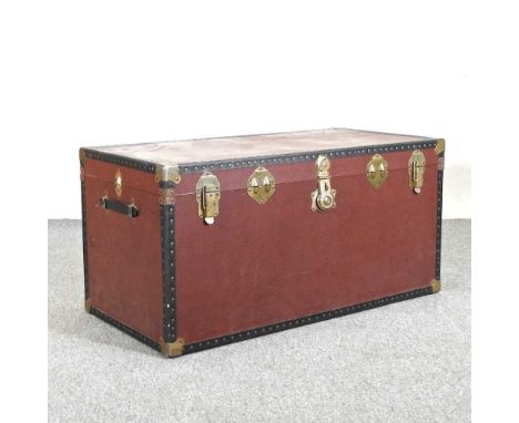 A studded travelling trunk, with a hinged lid102w x 49d x 51h cm