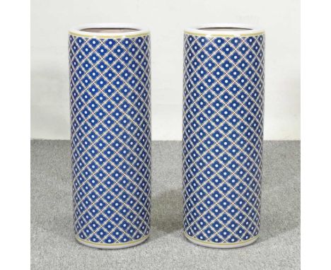 A pair of Chinese porcelain stick stands, with blue lattice decoration, 60cm high (2)