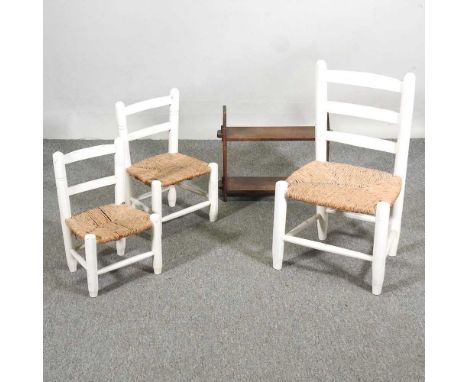 Three white painted child's chairs, together with a hanging shelf (4)