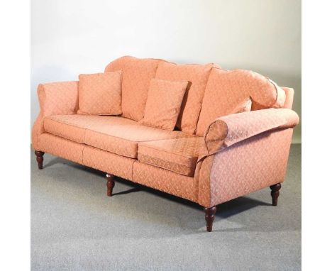 A modern peach upholstered sofa, recently re-upholstered, on turned feet220w x 90d x 85h cm