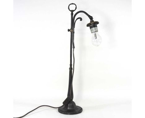 A mid 20th century bronzed adjustable desk lamp, 65cm high