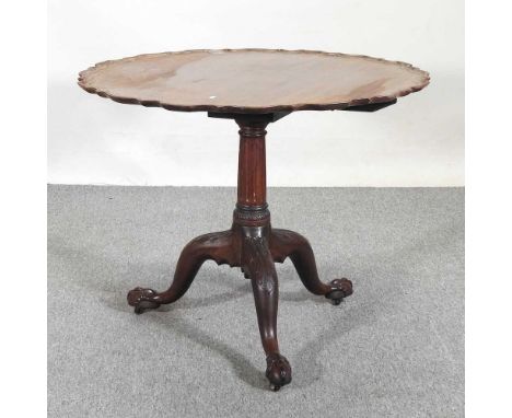 An early 20th century occasional table, with a hinged piecrust top, on a carved tripod base89w x 73h cm