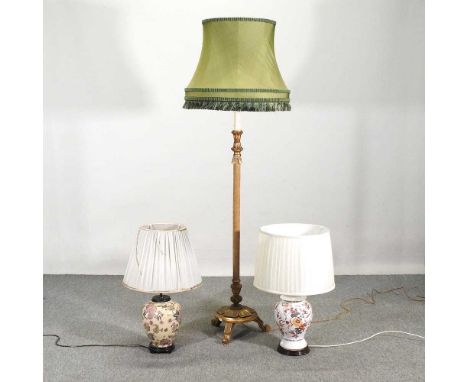 A gilt painted standard lamp and shade, 173cm high, together with two pottery table lamps and shades (3)