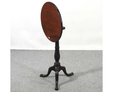 A 19th century mahogany occasional table, with a hinged circular top, on a tripod base46w x 70h cm