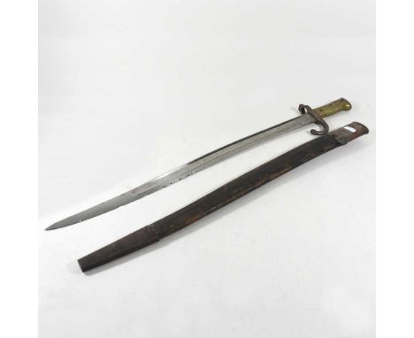 A late 19th century French 1866 model chassepot bayonet, stamped 8979, 71cm long, in a metal mounted leather scabbard