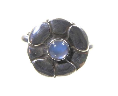 A silver Georg Jensen Moonlight Blossom ring, set with a cabochon moonstone, stamped marks and numbered 36, 8g, size N