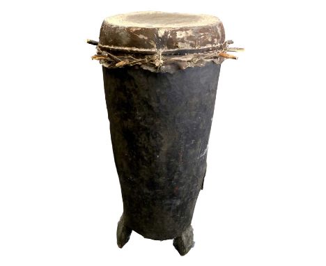 A Rare 19th Century Barundi Sacred Tree Drum, East Africa, carved from a large tree trunk, the resonator of stretched cow hid