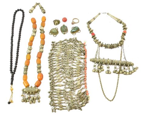 A Collection of Omani/Bedouin Jewellery, including a white metal necklace set with sixteen amber beads and with charm holder 