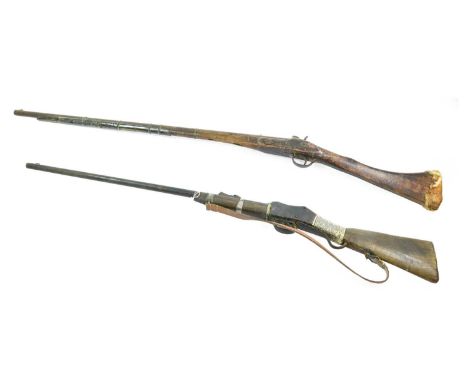 A 19th Century Martini Henry Carbine, with Omani fittings, the wood half stock with silver wire binding to the fore -end and 