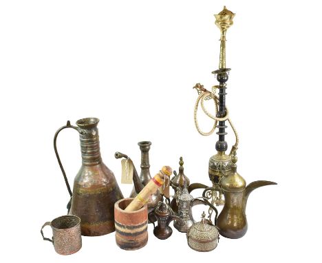 A Collection of Omani and Middle Eastern Artefacts, including an Omani saddle tree with flat weave padding and silvered mount