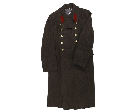 A Soviet Russian Greatcoat, to a Casual Officer of the Internal Troops, in grey wool with staybrite buttons and red wool lape