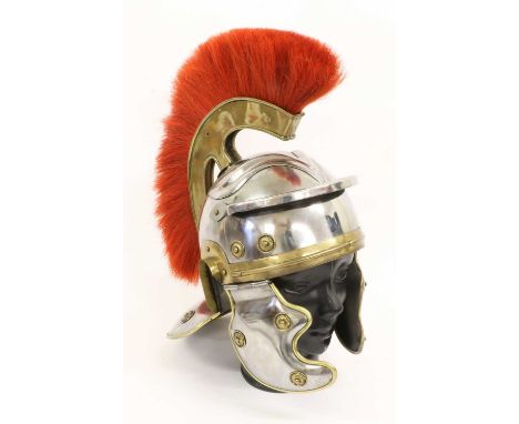 A Copy of a Roman Centurion's Helmet, in steel, with red horsehair and brass comb, brass edging and rosettes to the ear flaps