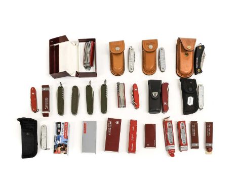 A Collection of Twenty Four Various Victorinox Swiss Army and Folding Pocket Knives, including four in leather cases, two in 