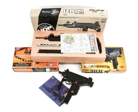 PURCHASER MUST BE 18 YEARS OF AGE OR OVERFour Airsoft Guns, comprising an SMG Uzi in original box, a Mini AK47 in original bo