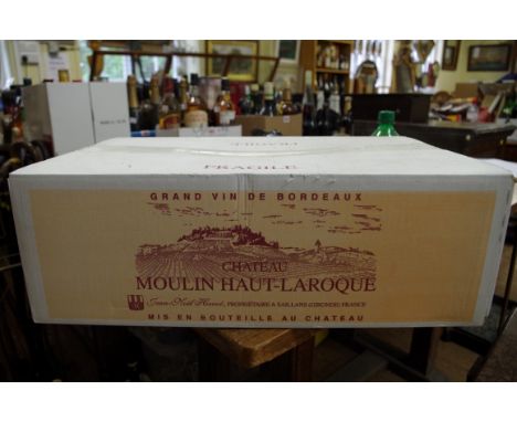 A case of twelve 75cl bottles of Moulin Haut Laroque,&nbsp;2005, in oc. (12)PLEASE NOTE: ADDITIONAL VAT ON THE HAMMER PRICE. 