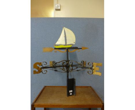 A wrought iron weather vane 