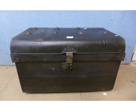 A tin steamer trunk 