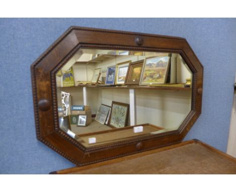 An oak octagonal framed mirror 