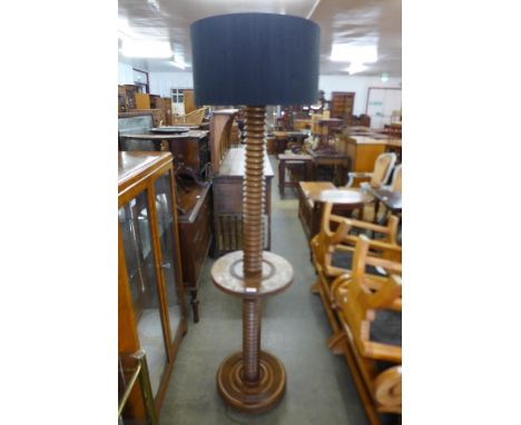 A French beech revolving standard lamp 