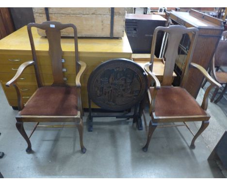 A Chinese carved wooden folding occasional table/firescreen and a pair of Queen Anne style mahogany elbow chairs 