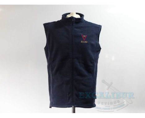 ALLIED (BRAD PITT) (2016) - a pair of crew clothing items comprising a navy L gilet and black cap - Provenance : These items 