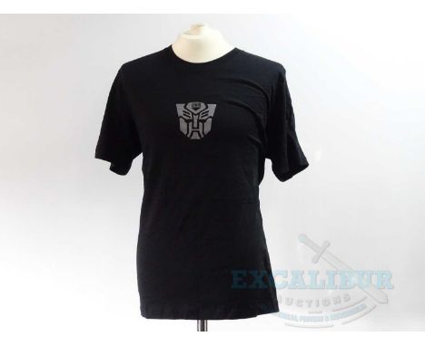 A group of three crew clothing items comprising TRANSFORMERS : THE LAST KNIGHT (2017) black short sleeved 'Locations' t-shirt