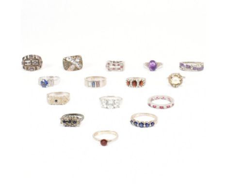 Assorted 925 silver and gem set rings. The rings to include a cultured pearl, synthetic sapphire, CZ, topaz, marcasite, clust