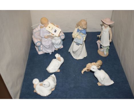 Two Nao ornaments modelled as young girls; three ornaments modelled as ducks; another as a nude reclining baby; and another S