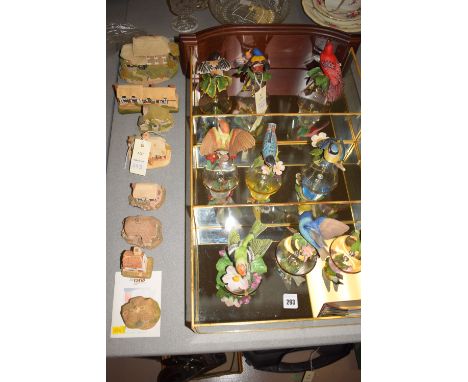 A collection of nine Franklin Mint hand-painted ceramic birds mounted on glass bells, together with certificates of authentic