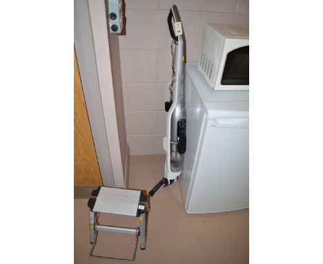 A Bosh Athlet battery powered vacuum cleaner; and a small step.