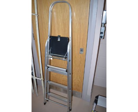A four tread aluminium step ladder. 