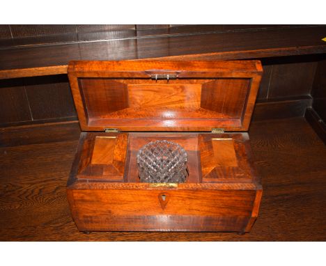A 19th Century rectangular walnut tea caddy, with two interior caddies and a mixing bowl.