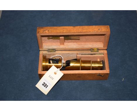 An early 20th Century brass student's microscope, in fitted mahogany case.