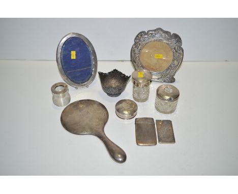 Two silver card cases (with damages and losses); two silver mounted photograph frames; a silver mounted hand mirror; three dr