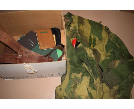 A box containing army related items, to include: Staff Officers Handbook, the 1980 Course; a Joint Service Adventurous Traini