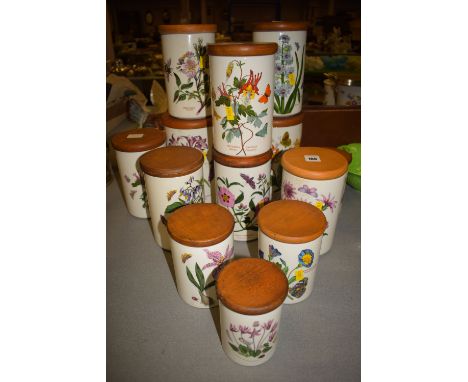 A collection of thirteen ceramic storage jars, by Portmeirion, from the 'Botanic Garden' series, each fitted with a wooden li