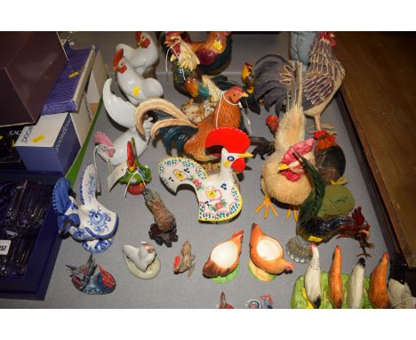 A collection of ceramic and other ornaments modelled as various cockerels and hens.