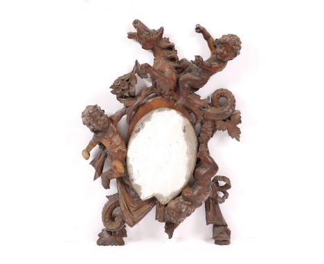 AN ANTIQUE ITALIAN CARVED WOODEN FRAME HANGING WALL MIRROR decorated with putti riding sea horses, approximately 80 x 56cm ov