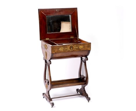 A FRENCH SECOND EMPIRE MAHOGANY WORK TABLE with fitted interior and mirror, gilt metal mounts and on lyre end supports, 48cm 