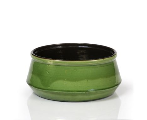 CHARLES HUBERT BRANNAM FOR LIBERTY OF LONDON, an Arts & Crafts green ceramic circular ovoid bowl, 23cm diameter
