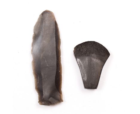 A NEOLITHIC EUROPEAN MINIATURE STONE AXE and a British Neolithic black flint knife, knife 9.5cm long (2)